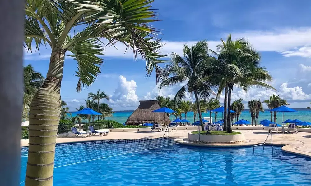 Escape to The Reef Playacar Resort Hotel & Spa in Mexico for an unforgettable family getaway. Airfare not included.