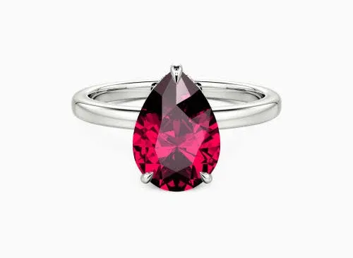 All About Us" Pear Cut Side Stone Engagement Ring